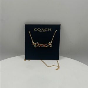 1179. Coach Gold Necklace with Multicolor Logo